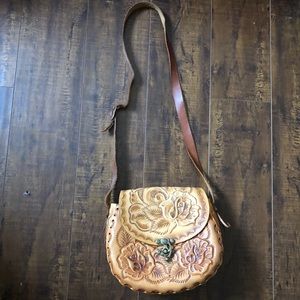 Floral imprinted leather cross body bag
